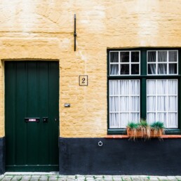 windows and dark green door