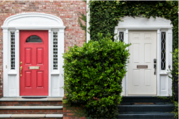 red fibreglass door vs white steel door comparison
